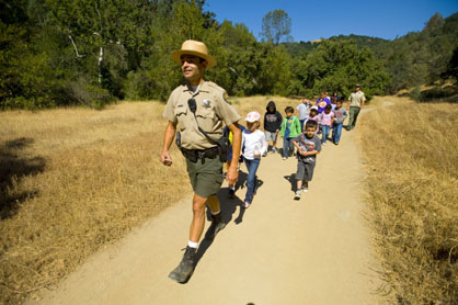 Ranger hiking with children